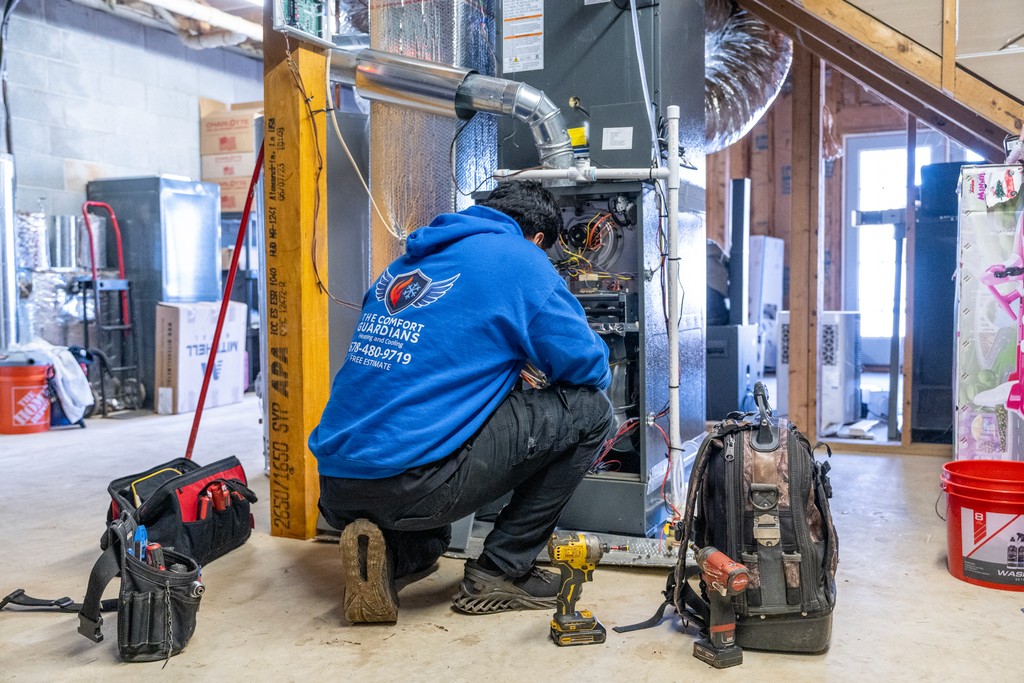 HVAC technician servicing cooling equipment
